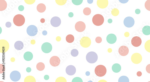 Colorful dots pattern viewed from directly above a white surface featuring various pastel colored circles, creating a visually appealing design