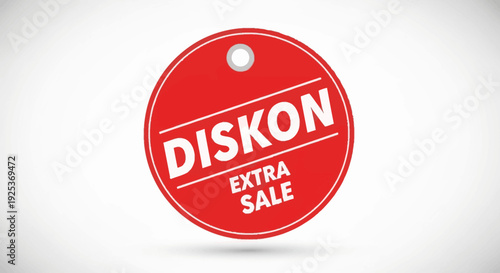 Red circular sale label with DISKON EXTRA SALE text on white background viewed from front
