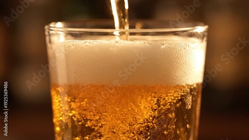 Wallpaper Mural Refreshing Golden Beer Poured into a Glass with Frothy Head and Bubbles. Torontodigital.ca