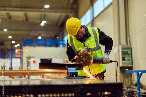 Photography Industrial Worker Grinding Steel in Warehouse Factory Wearing Safety Helmet and