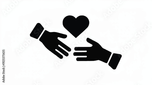 Hands passing a heart symbol  charity and love concept