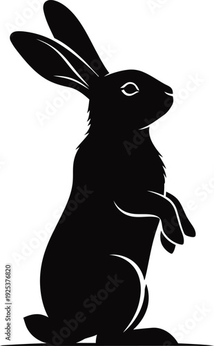 A black silhouette of a rabbit standing on its hind legs