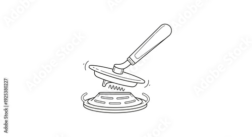 Close-up of a kitchen sink drain cover being removed with a tool