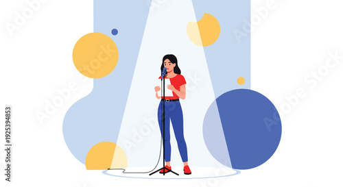 Confident woman in a red shirt stands on a stage and speaks into a microphone while holding notes under a bright spotlight at an event.