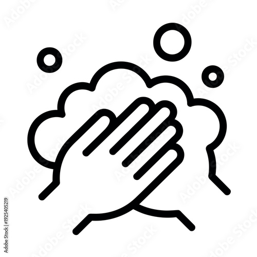 A hand washing with soap and water bubbles