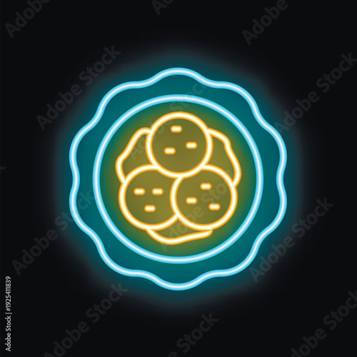 Neon sign is glowing brightly against a dark background, showcasing a plate of falafel