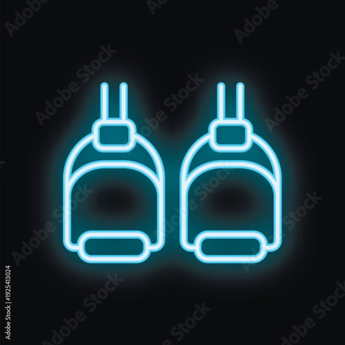Neon icon of a pair of horse riding stirrup irons is glowing brightly against a dark background