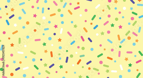Vibrant and whimsical confectionery sprinkle pattern on a cheerful pale yellow backdrop creating a delightful and celebratory aesthetic for various