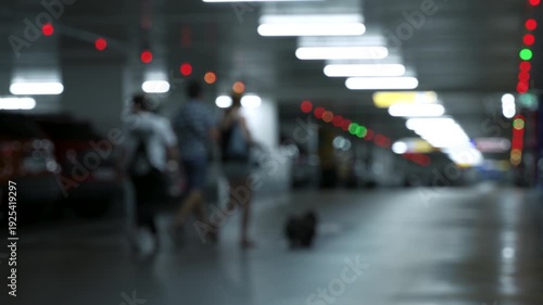 Wallpaper Mural Blurred People Walking in Underground Parking Garage with Bokeh Lights 4K Torontodigital.ca
