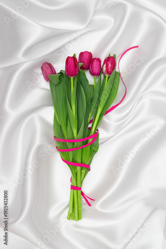 Wallpaper Mural Minimal style composition made of beautiful tulip flowers bouquet on white silk background.  Greeting card theme. Torontodigital.ca