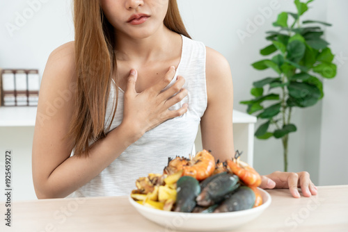 Canvas Print food allergies, women have reactions itching and redness after eating shrimp, se
