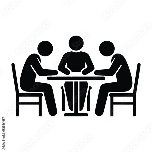 Three people sitting at a table in meeting