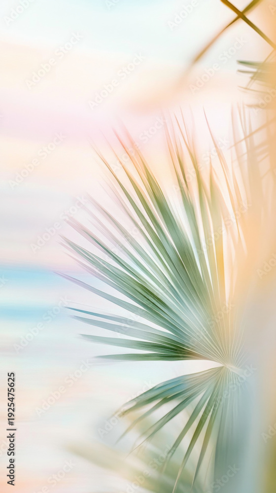 Obraz premium Blurry out-of-focus palm trees with pastel sky background