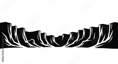 Desert canyon landscape with deep ravine and cliffs