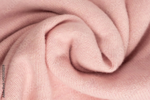 Soft pink cashmere sweater texture background.