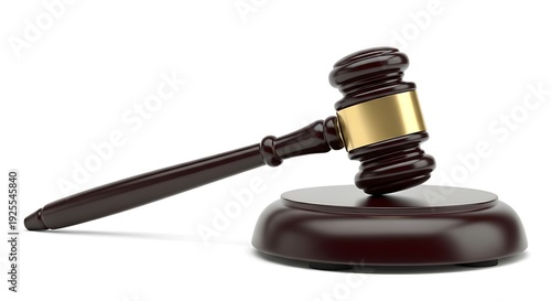 A close-up of a wooden gavel and sound block, commonly used in legal proceedings