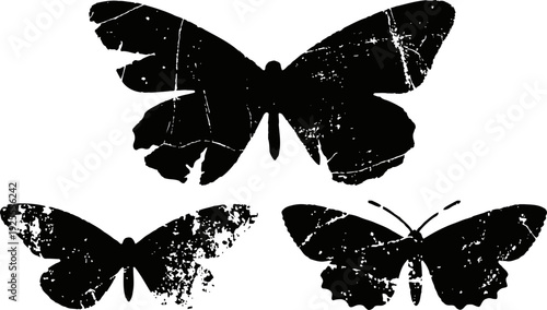 Black silhouette butterflies with distressed textured effect on white background