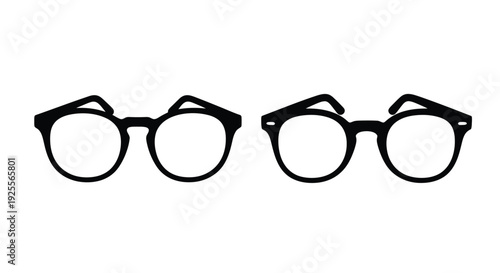 A collection of four black framed eyeglasses displayed in a row