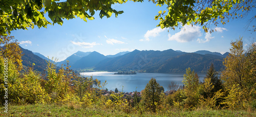 viewpoint Haiderdenkmal, hiking destination Schliersee, framed by green leaves, bavarian alps