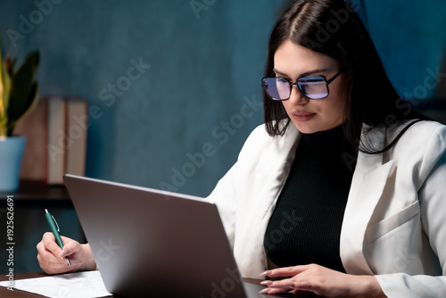 Business analyst woman examining performance growth charts indoors. Business intelligence concept
