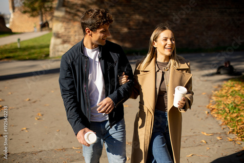 Couple enjoying walk while ...