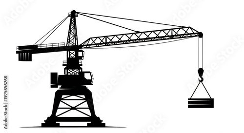 A black and white image of a crane lifting a load
