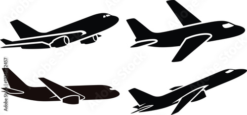 Four Black Airplane Silhouettes in Different Positions