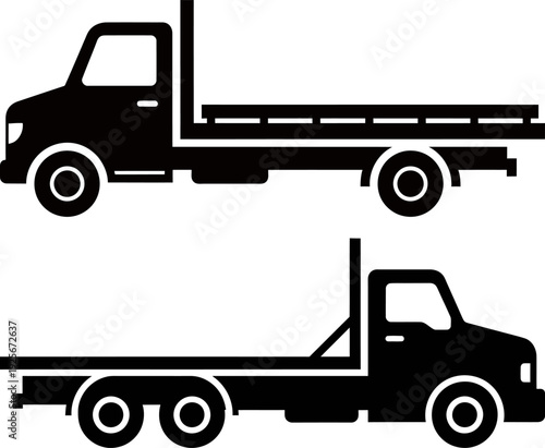 Two black flatbed trucks with flatbed trailers transportation