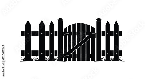 Black wooden fence with arched gate and grass striking silhouette