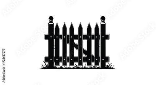 A black picket fence with grass details a striking silhouette