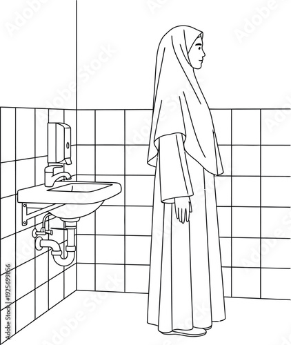 Woman in hijab standing next to bathroom sink with tiled wall