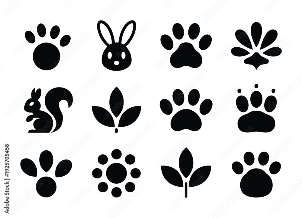 Fototapeta premium Collection of vector of icons of animals, paw prints, and leaves