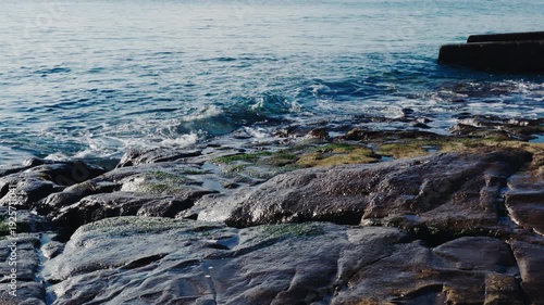 Waves hit the rock at Cape Inamuragasaki, Kamakura, Japan.
