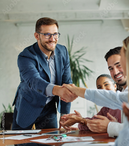 Canvas Print Group of young business people having a meeting shaking hands handshake introducing each other during meeting in the office