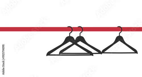 Three black coat hangers hanging on a red clothing rod