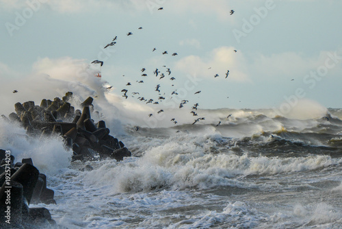 Foto Powerful Baltic Sea storm hitting Liepaja harbor breakwater with crashing waves