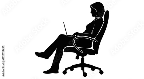 Silhouette of a person working on a laptop in an office chair