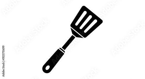 Black silhouette of a kitchen spatula on a plain white background
