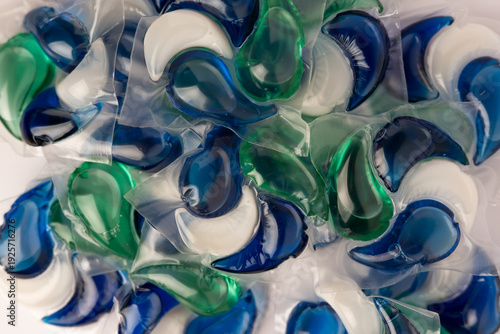 Close-up of a laundry pod with blue and green liquid detergent
