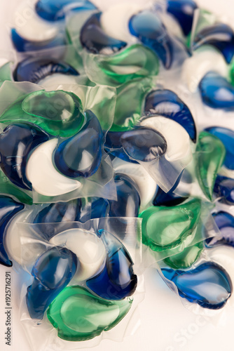 Close-up of a laundry pod with blue and green liquid detergent