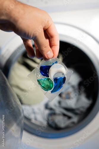 Close-up of a laundry pod with blue and green liquid detergent