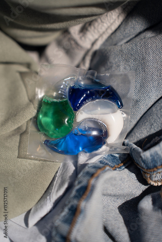 Close-up of a laundry pod with blue and green liquid detergent