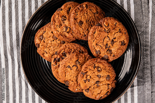 Chocolate cookies with chocolate chips sweet dessert homemade baking tasty snack fresh gourmet food background on the table rustic food top view copy space marketing concept photo