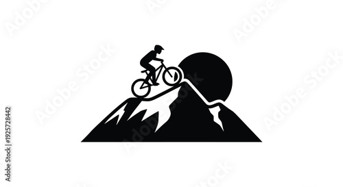 Cyclist riding a mountain bike uphill a striking black silhouette