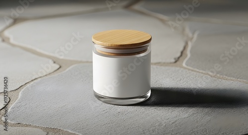 Image of a glass jar with a bamboo lid and a white label, placed on a stone surface. 