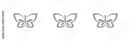 Three stylized grey butterflies arranged in a horizontal line on a black background