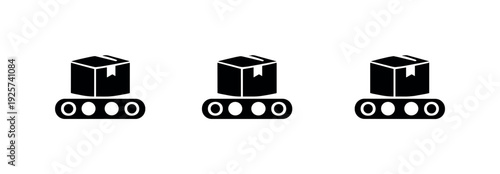 Three identical boxes moving on conveyor belts in a factory production line