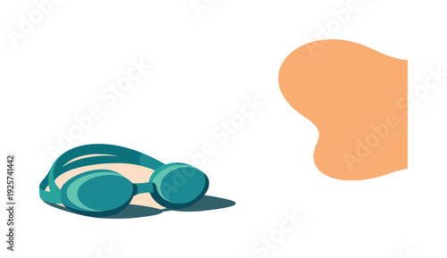 Teal swimming goggles resting on a light peach background with abstract orange shape
