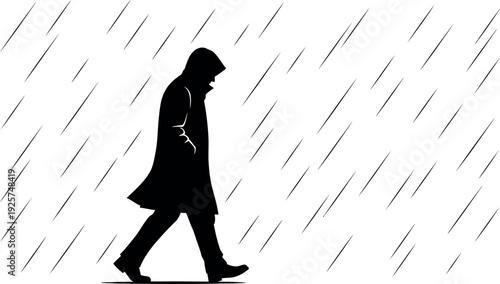 Silhouette of a person walking alone in the rain