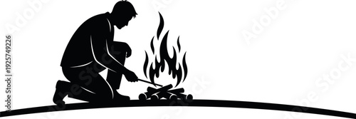 Silhouette of a man and child building a campfire